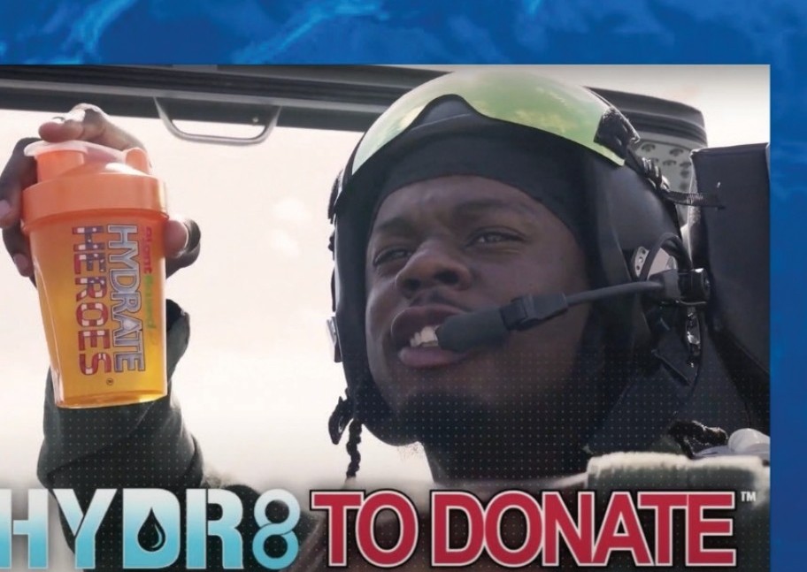 NFL Linebacker Jerome Baker in a jet cockpit holding a Hydrate Heroes shaker — Hydrate To Donate™