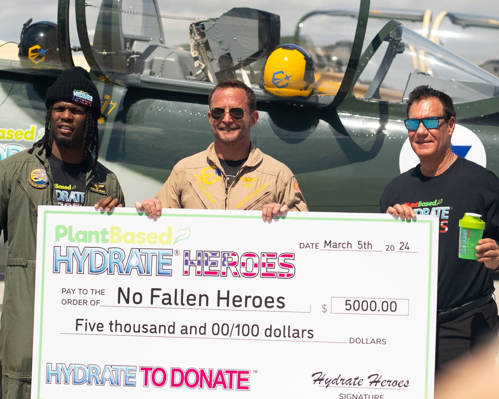 Hydrate Heroes presenting a donation check to No Fallen Heroes, founded by Matthew Whiz Buckley